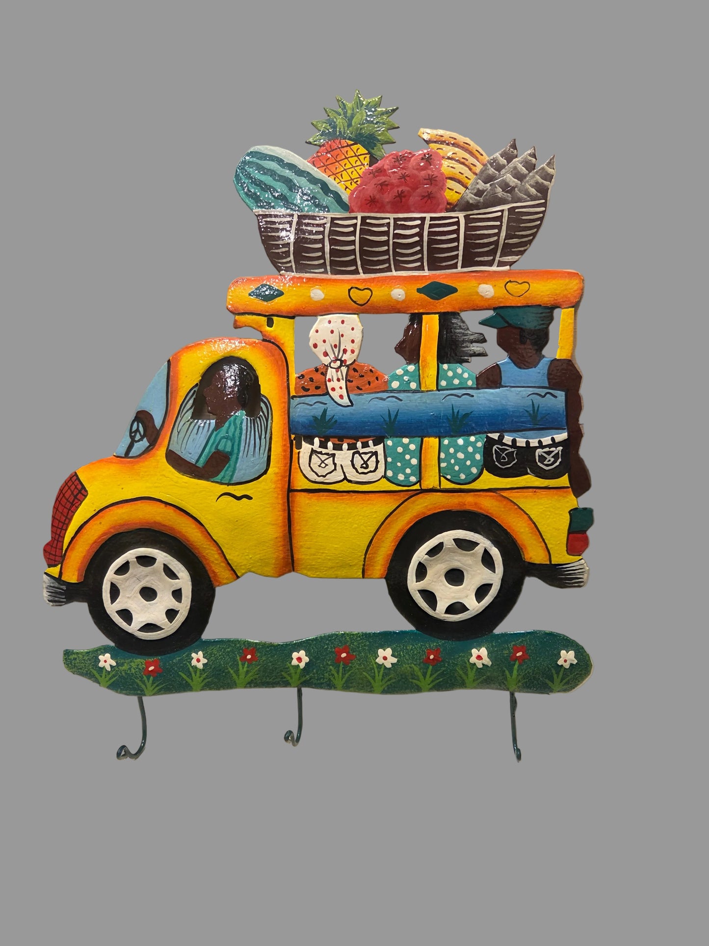 Colorful wall art of a bus "Tap Tap" with various patterns and designs.