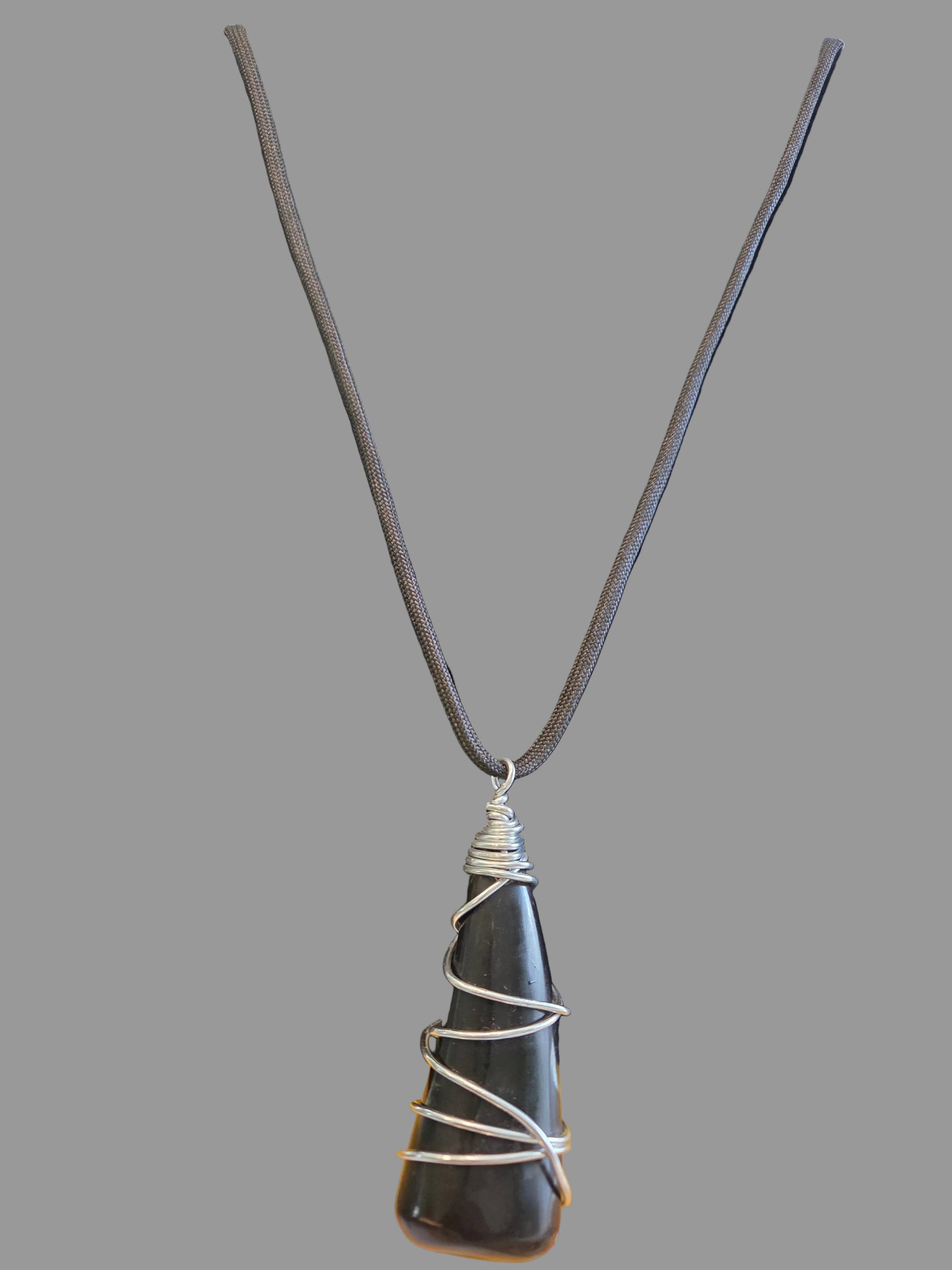 Necklace with a black stone pendant