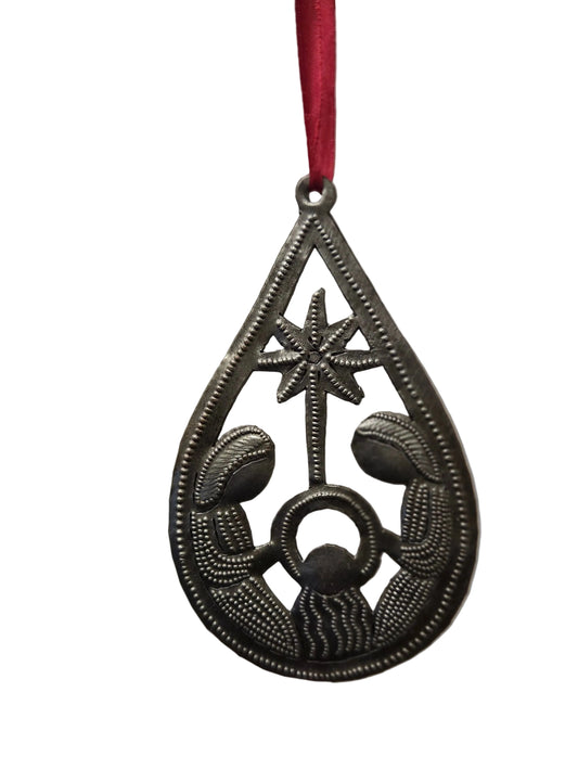Decorative metal ornament with a star and circular design on a blurred background