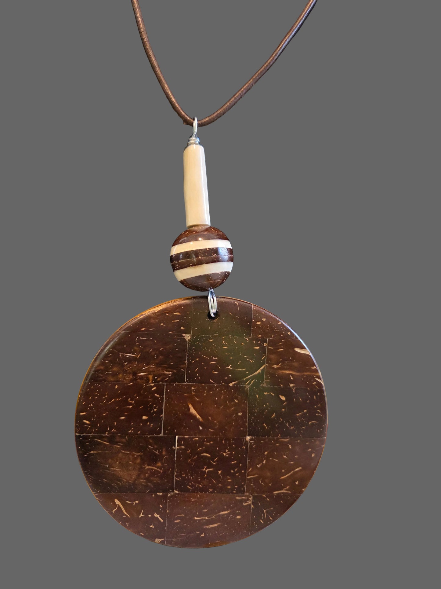 Necklace with a large round brown pendant 