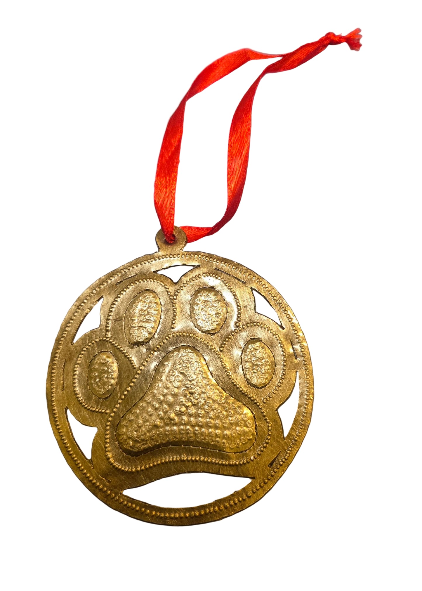 Gold paw print pendant on a red ribbon against a gray background